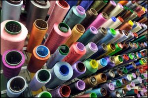 A vibrant assortment of colorful threads arranged neatly in various shades and hues.