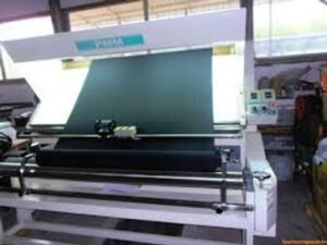 A fabric-making machine with various components, showcasing its intricate design and functionality in textile production.